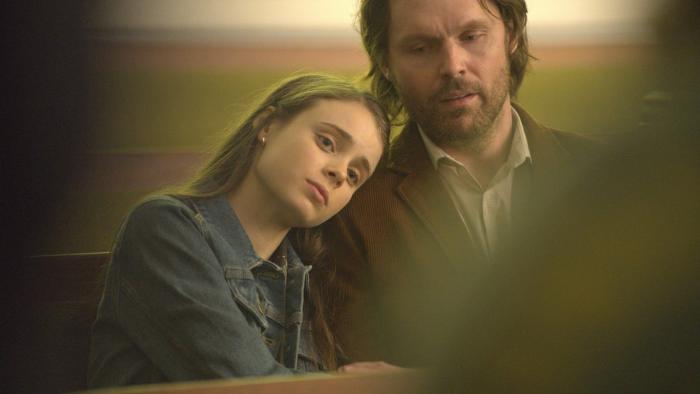 Red Right Hand Movie: Savannah (Chapel Oaks) and her father Finney (Scott Haze) appear to be sitting in a pew in church; she leans her head on his shoulder