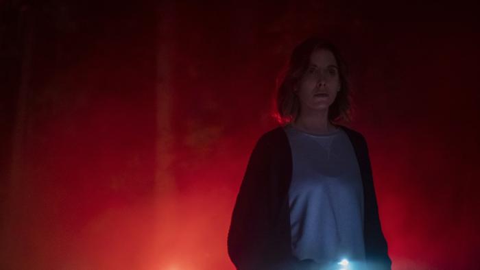 The Rental Movie: Michelle at night with flashlight