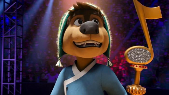 A brown dog named Rock dog stands with a smile on his face with a giant music note behind him 