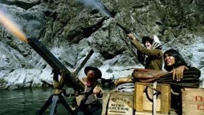 Rooster Cogburn: Katharine Hepburn shoots a rifle