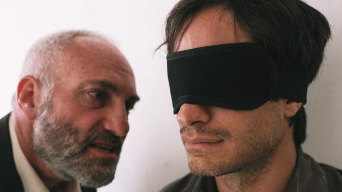 Maziar Bahari, a freelancer for Newsweek magazine is being interrogated.