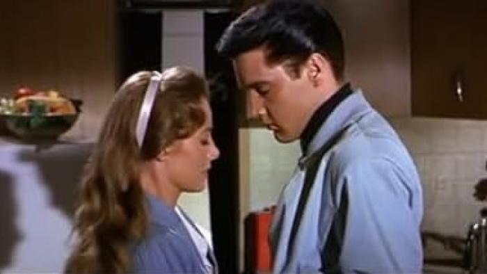 Roustabout: Joan Freeman and Elvis Presley stand face to face in a kitchen