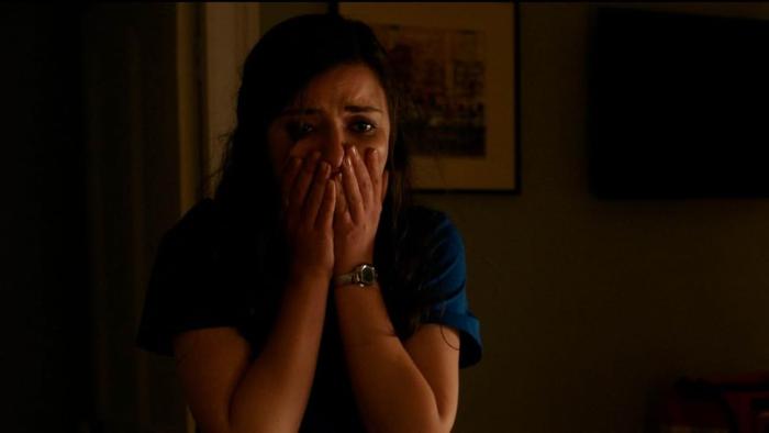 The Ruse Movie: A terrified Dale holds her hands to her face as if to stifle a scream