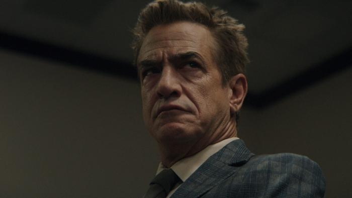 Ruthless: Dermot Mulroney looks serious in a grey suit