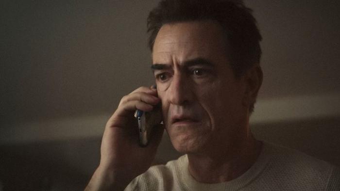 Ruthless: Dermot Mulroney looks anxious as he speaks into a phone