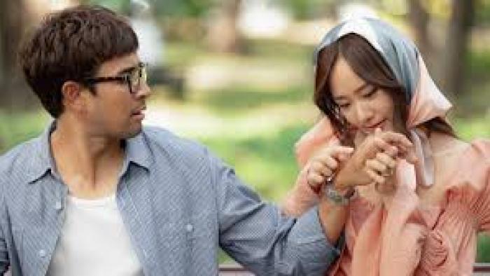 Same Day with Someone: Asian woman examines Asian man's hands