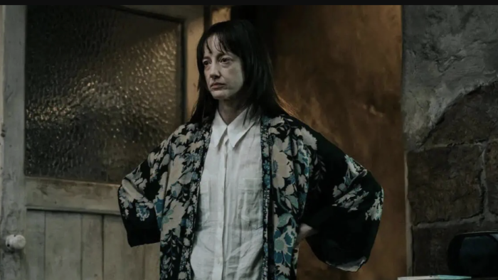 Heel: Andrea Riseborough has her hands on her hips