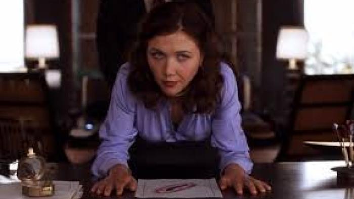 Secretary: Maggie Gyllenhaal at work