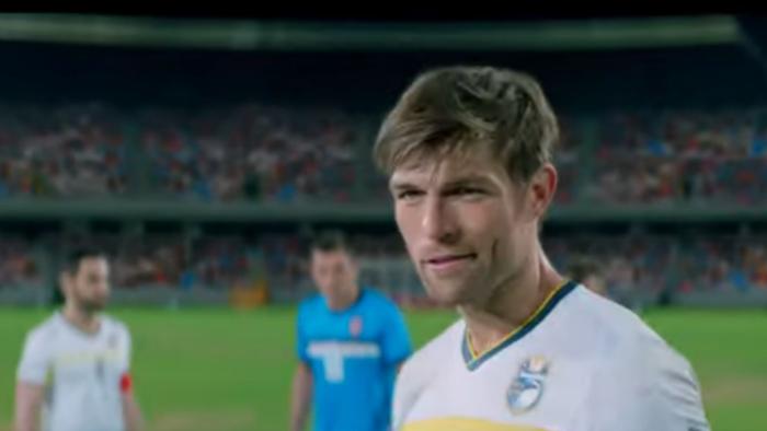 See You Soon Movie: Ryan grins as he readies to kick a goal