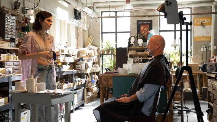 Seven Veils movie: Rebecca Lilliard stands across from a seated Michael Kupfer-Radecky in the prop department