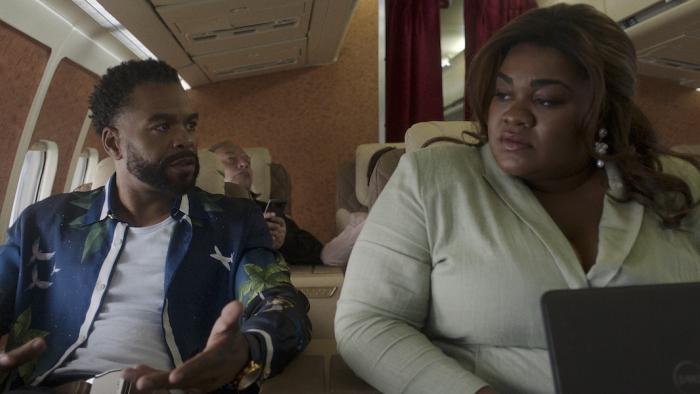 Shadow Force Movie: "Unc" (Method Man) and "Auntie" (Da’Vine Joy Randolph) argue about something during a plane ride