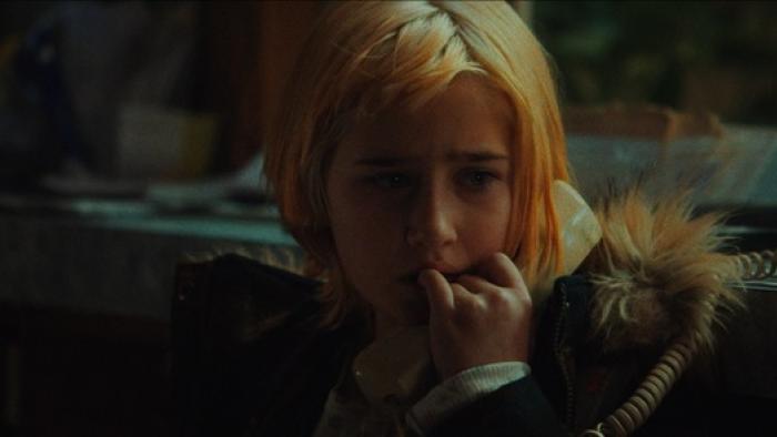 She Rides Shotgun Movie: Eleven year-old Polly chews her fingers while nervously talking on the phone