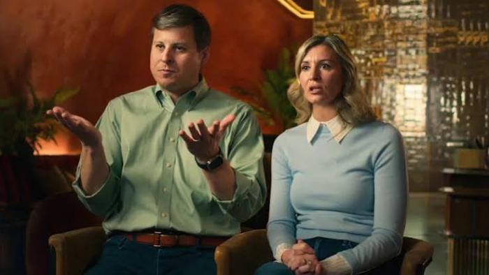 Shipwrecked: Nightmare at Sea: White man and woman sitting indoors, gesturing, with a warm-lit background.