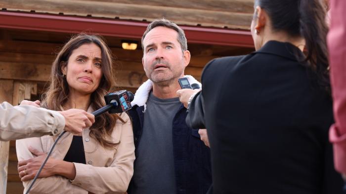 Shrapnel: Sean Beckwith (Jason Patric, center) and wife Susan (Kesia Elwin, to his left) are interviewed for local TV news