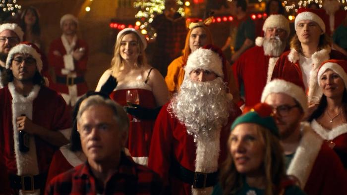 Silent Night, Deadly Night Movie: Dressed as Santa Claus, Billy stands among of several others wearing Santa gear
