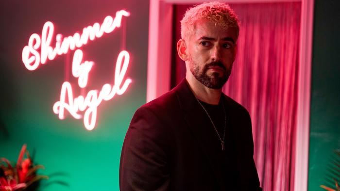Skincare movie: Luis Gerardo Méndez in a pink and green room with a pink neon sign reading Shimmer y Angel
