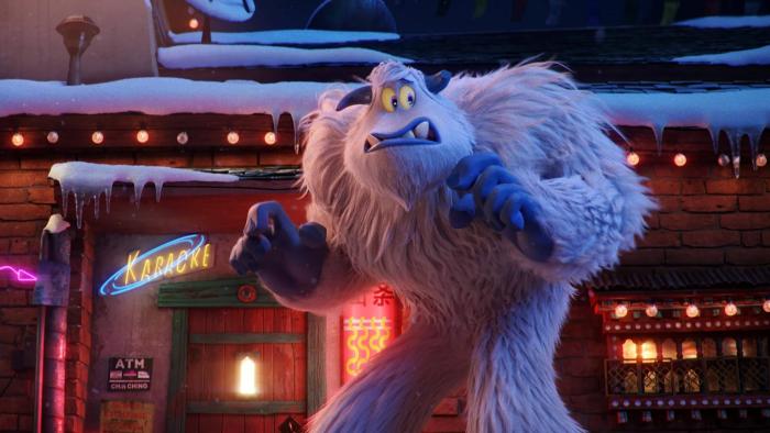 Smallfoot movie: Migo grimaces as he creeps through a human settlement, looking nervous