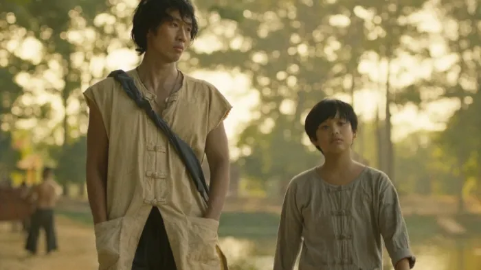 Song of the South: Tuan Tran and Huynh Hao Khang walk through the woods.