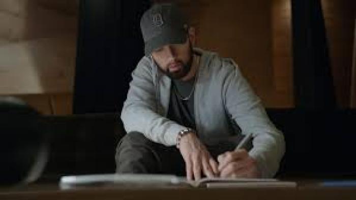 Stans: Eminem writing something.