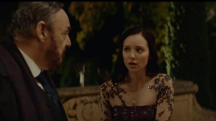 Starbright movie: John Rhys-Davies and Alexandra Dowling having a conversation outdoors at night.