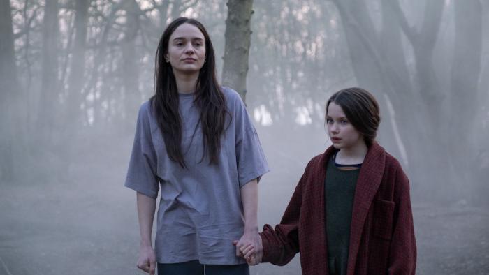Stopmotion Movie: Ella (Aisling Franciosi) walks hand-in-hand with a little girl (Caoilinn Springall) through a foggy wood