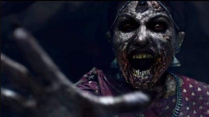 Stree: A scary close-up of Stree with her charred skin as she reaches out with a hand to attack someone while screaming