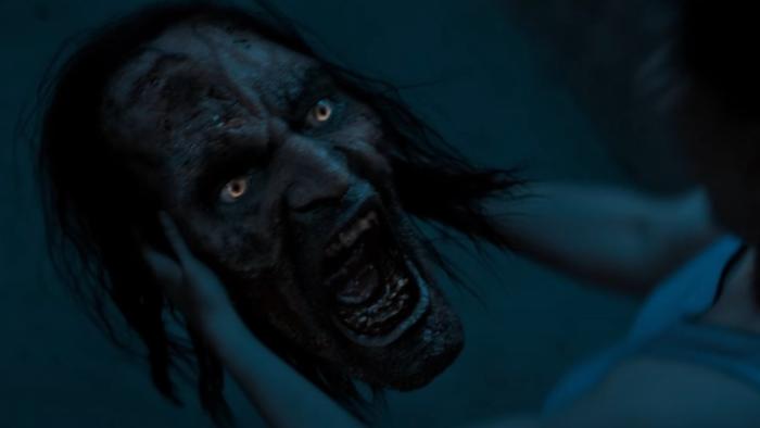 Stree 2: A giant severed head of a monster grotesquely screams at a woman who is off-screen
