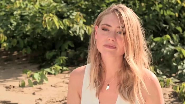 Strictly Confidential: Georgia Lock sits on a beach looking wistful