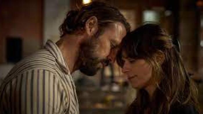 Stromboli: a man and woman have their heads together affectionately