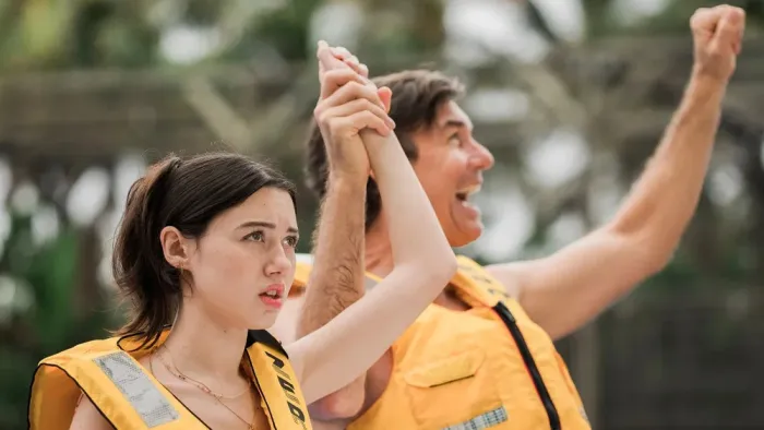 Summer's Last Resort: Summer and Glenn wearing lifejackets with Glenn with arms in the air in triumph.