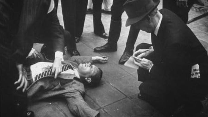 Sunset Boulevard movie: A man lies dead on the ground as police surround him