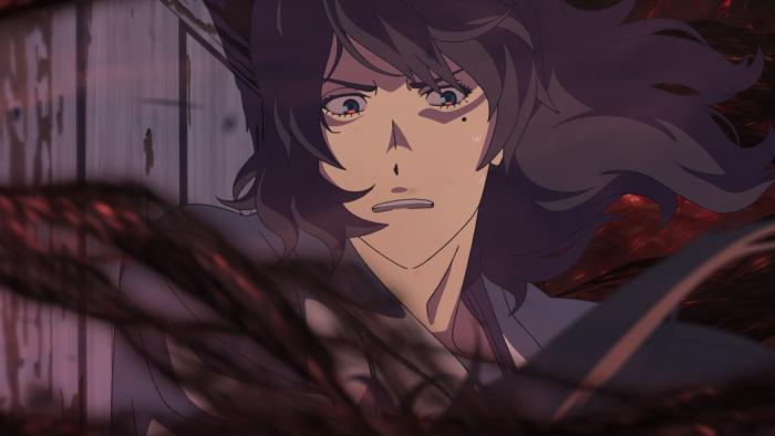 Suzume movie: Souta is concerned as he closes a door with black and red tentacles that are spilling out of a portal