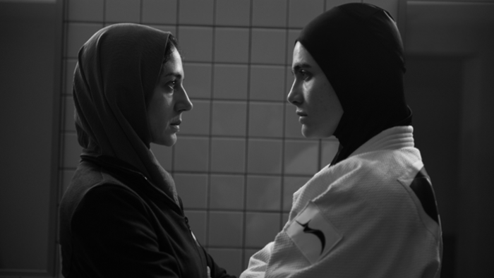 Tatami movie: Maryam (Zar Amir Ebrahimi) and Leila (Arienne Mandi) stare each other down