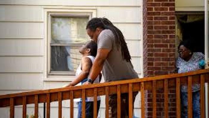 Tell Them You Love Me: Black family outside on porch