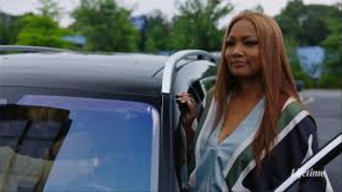 Terry McMillan Presents: Tempted by Love: Garcelle Beauvais opens car door