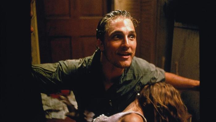 Texas Chainsaw Massacre—The New Generation: Man with wet hair looks upward, arms outstretched, and a woman seemingly laying in front of him