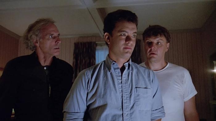 The 'Burbs Movie: Tom Hanks and two other men inside a house with the lights off