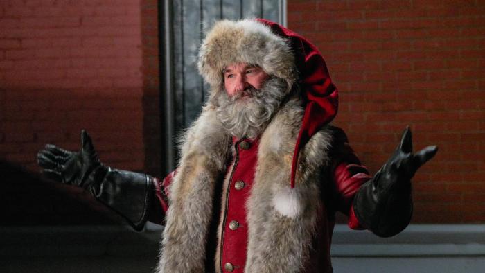 The Christmas Chronicles movie: Santa in his red suit and hat has his arms outstretched, presenting himself
