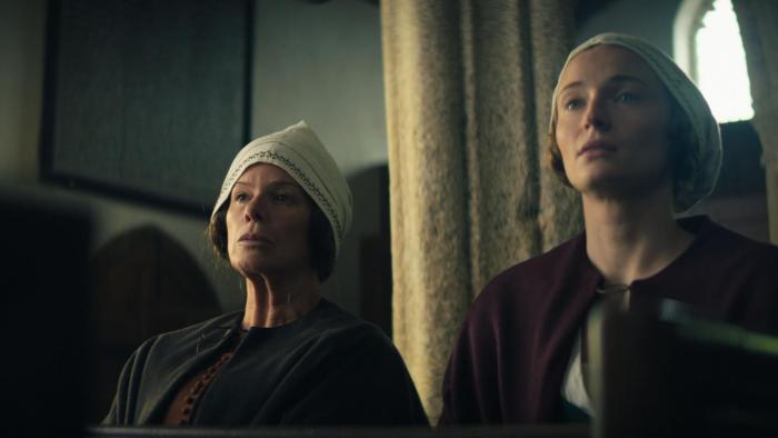 The Dreadful: Marcia Gay Harden and Sophie Turner stand next to each other in church, looking serious