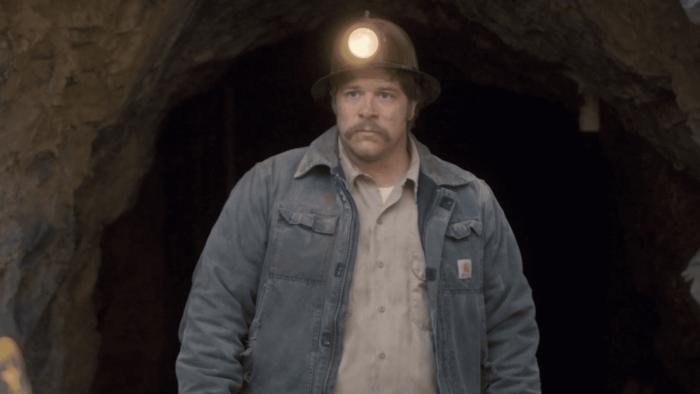 The Faith of Angels Movie: John Michael Finley walks out of a cave wearing a miner's helmet