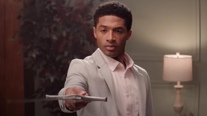 The Forge movie: Aspen Kennedy holds a sword out to symbolize his faith