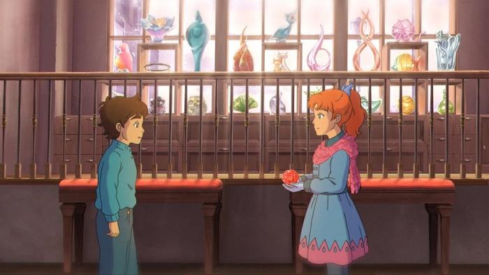 The Glassworker movie: Young Alliz holds a glass rose out to young Vincent