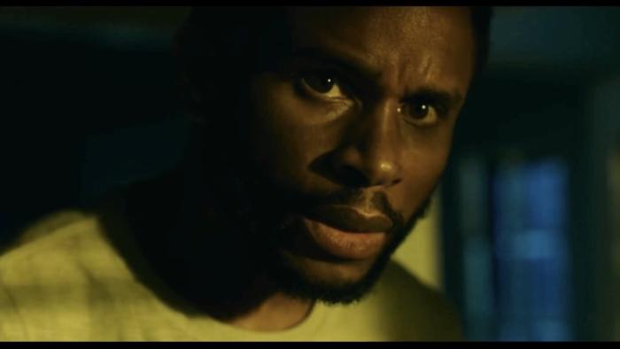 The Knife movie: Nnamdi Asomugha looks with concern around the corner of his house in the middle of the night