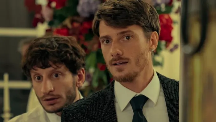 The Love Scam: Brothers peek around a corner.