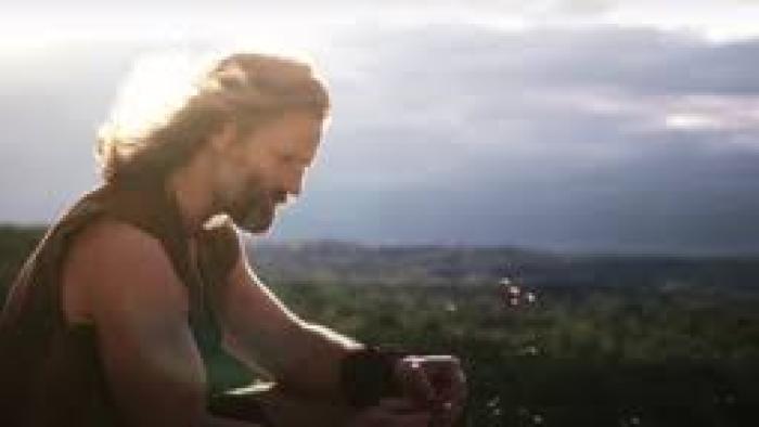 The Oath Movie: Darin Scott stands on a hill looking out in the distance