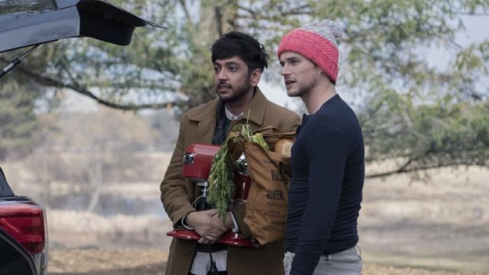 The Parenting: Nik Dodani and Brandon Flynn by a car.