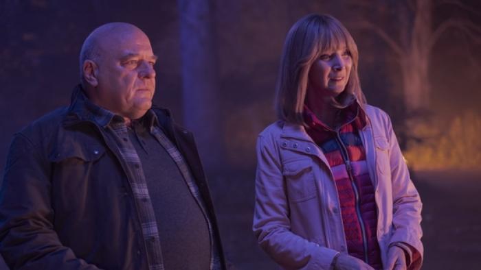 The Parenting: Dean Norris and Lisa Kudrow in jackets.