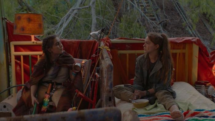 The Park: Two girls sit in a post-apocalyptic tree fort hideout.