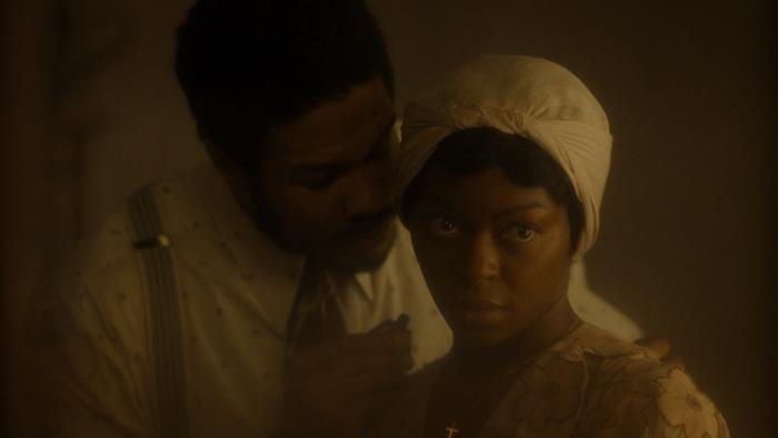 The Piano Lesson movie: Ray Fisher leans down toward Danielle Deadwyler