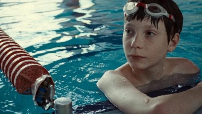 The Plague movie: Everett Blunck is in the water, looking at what's happening around him